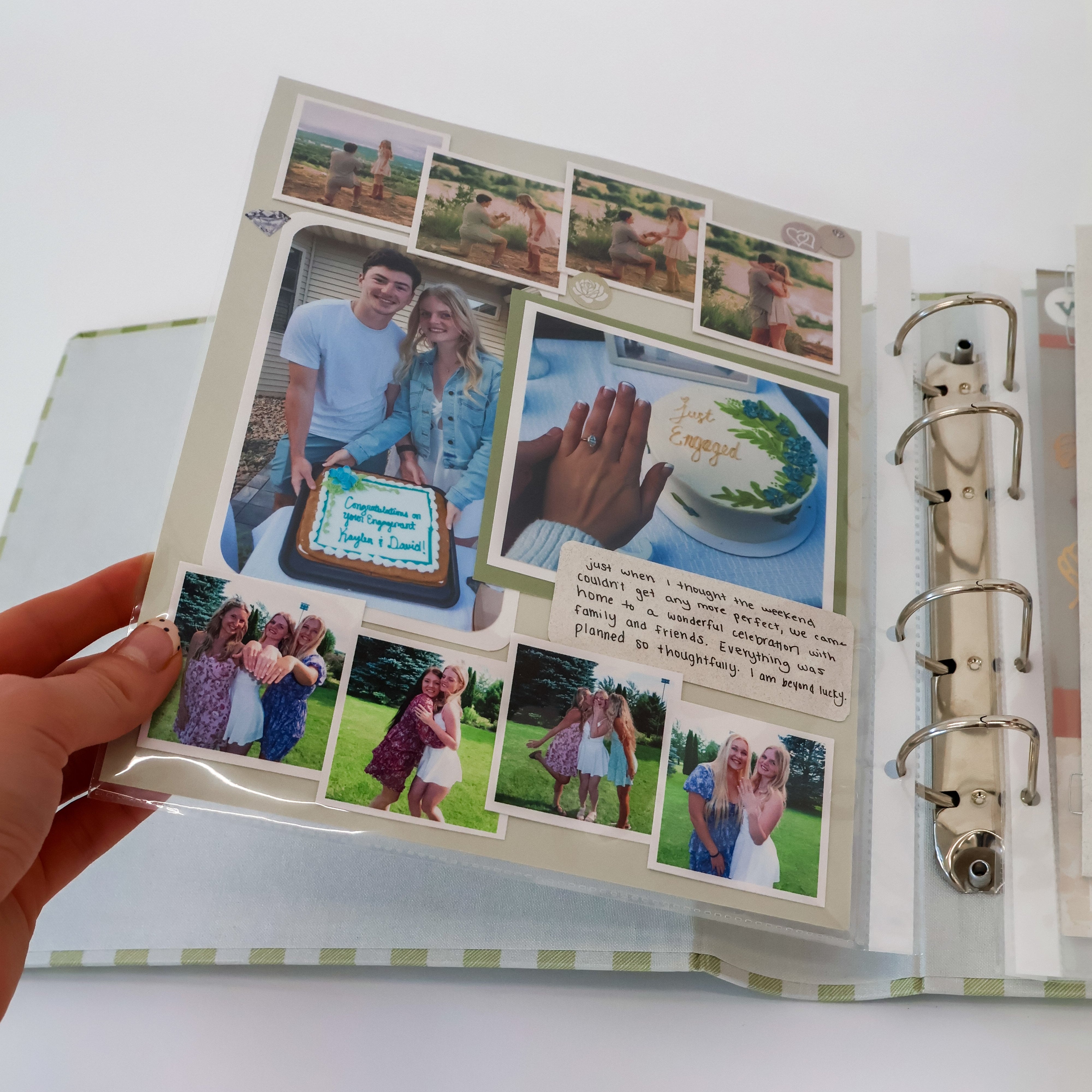 Person holding a scrapbook with various photos and memories.