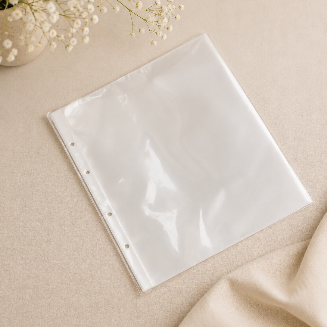 Clear plastic sheet on a beige surface with flowers in the background